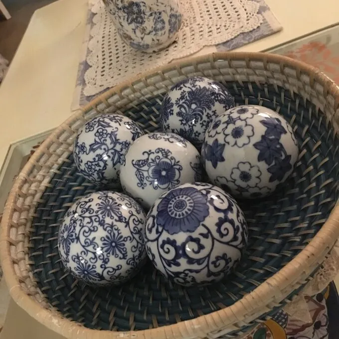 DeKalb Floral Design Decorative Porcelain Balls (Set of 6), bunch them together in a ceramic bowl for an artful accent.  Retails $107 