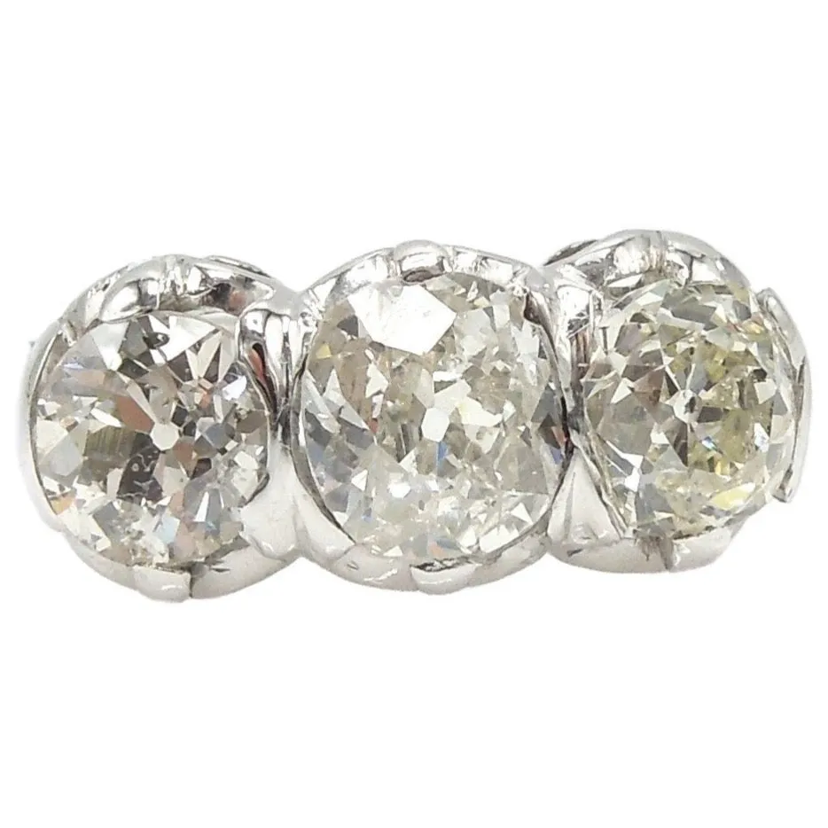 Filigree Edwardian 2.41ct Three Stone Old Mine Cut Diamond Ring in Platinum
