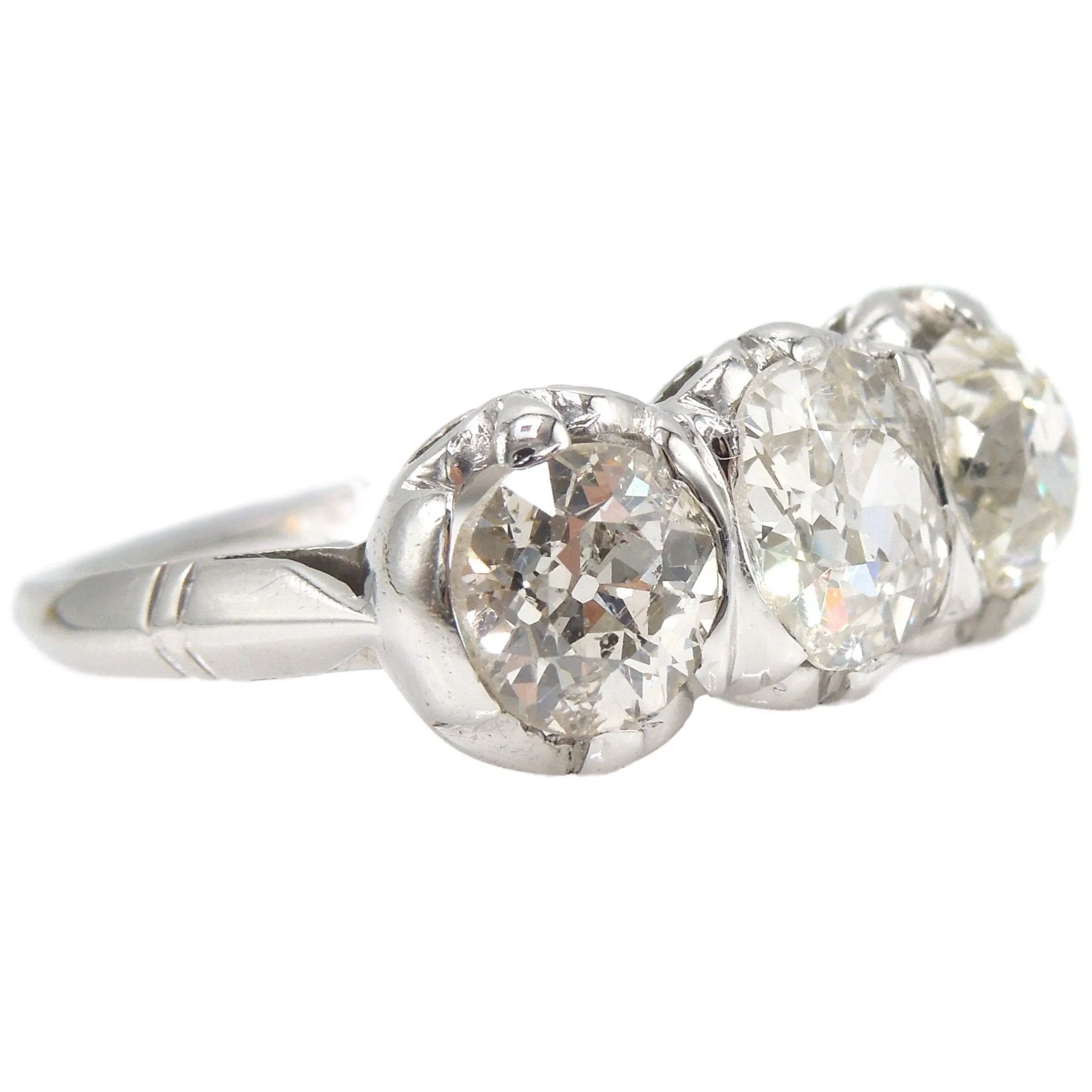 Filigree Edwardian 2.41ct Three Stone Old Mine Cut Diamond Ring in Platinum