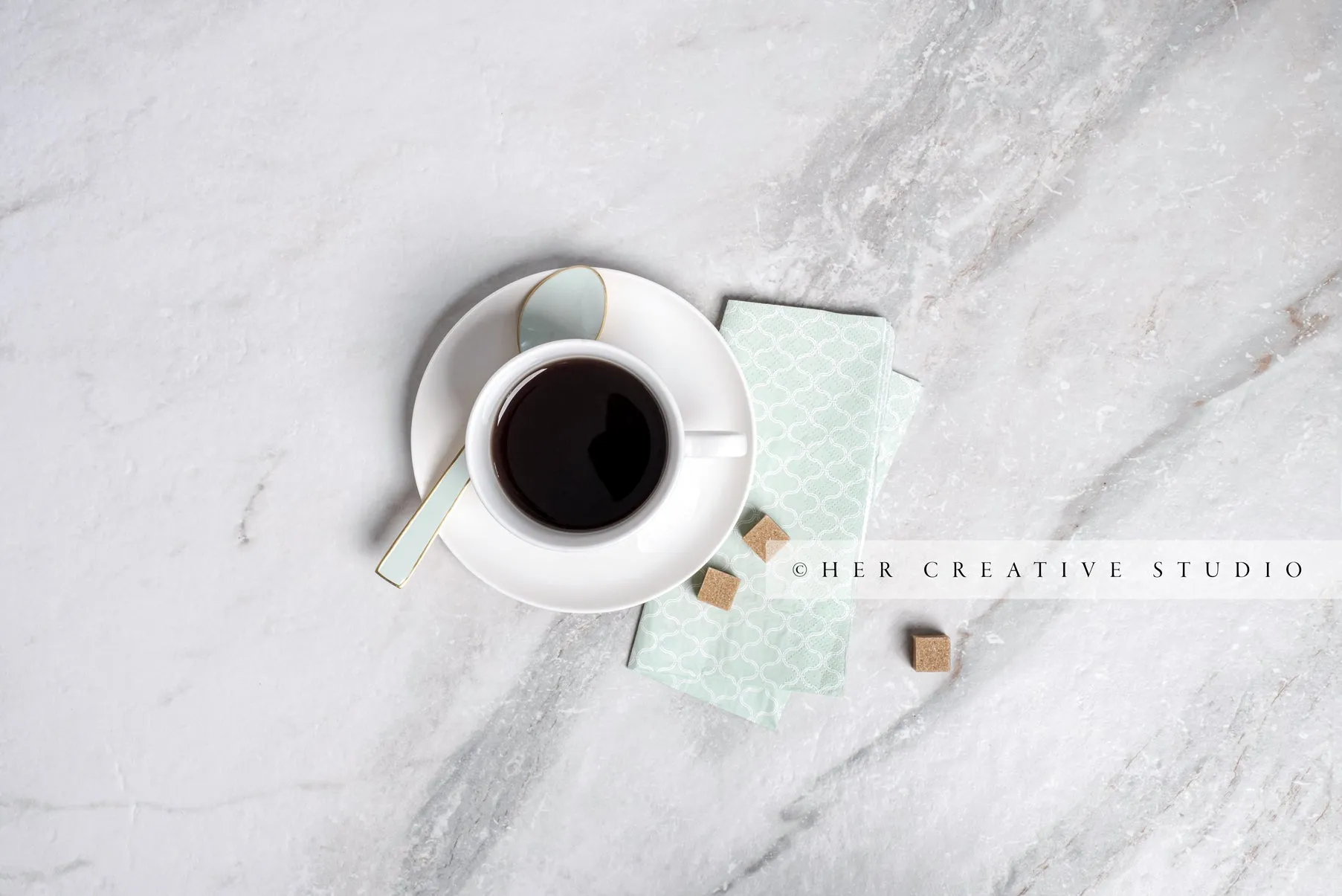 Tea with Sugar Cubes on Marble