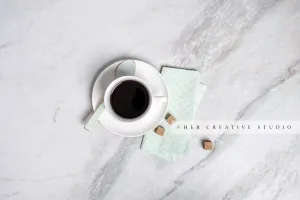 Tea with Sugar Cubes on Marble